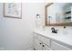 Bright half-bathroom with white vanity and framed mirror at 11141 Saybrook Ct, Fishers, IN 46037