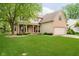 Beautiful two-story home with a well-maintained lawn, covered front porch, and attached two-car garage at 11141 Saybrook Ct, Fishers, IN 46037