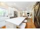 Bright, modern kitchen featuring white cabinets, center island with seating, and stainless steel appliances at 11141 Saybrook Ct, Fishers, IN 46037