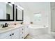Bright main bathroom with dual vanities, garden tub, and a separate shower at 11141 Saybrook Ct, Fishers, IN 46037