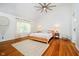 Bright main bedroom features wood floors, soft rug, and natural light at 11141 Saybrook Ct, Fishers, IN 46037