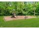 A well-maintained playground with climbing structures, swings, and a picnic table for outdoor fun at 11141 Saybrook Ct, Fishers, IN 46037