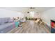 Spacious playroom in finished attic with hardwood floors, plentiful light, and toys at 11141 Saybrook Ct, Fishers, IN 46037