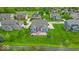 An aerial view showcases the home's backyard, landscaping, and patio with a beautiful pergola at 11438 Montoya Dr, Zionsville, IN 46077