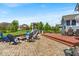 Outdoor space features a stone patio, a fire pit with seating, a deck, and a built-in grill at 11438 Montoya Dr, Zionsville, IN 46077
