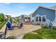Backyard with a patio area, a fire pit, a built-in grill, a pergola, and green grass at 11438 Montoya Dr, Zionsville, IN 46077
