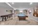 Finished basement with a pool table, shuffleboard, and other entertainment features on a carpeted floor at 11438 Montoya Dr, Zionsville, IN 46077