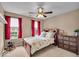 Comfortable bedroom bathed in natural light from two windows is well decorated and inviting at 11438 Montoya Dr, Zionsville, IN 46077