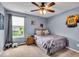 Comfortable bedroom featuring a cozy bed, natural light, and charming decor at 11438 Montoya Dr, Zionsville, IN 46077