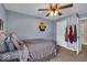 Cozy bedroom features a ceiling fan and neutral paint, creating a relaxing space at 11438 Montoya Dr, Zionsville, IN 46077