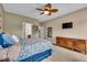 Well-lit bedroom featuring ceiling fan, carpet floors, and a chest of drawers at 11438 Montoya Dr, Zionsville, IN 46077