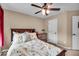 Inviting bedroom features a ceiling fan, a full sized bed and natural light from a window at 11438 Montoya Dr, Zionsville, IN 46077