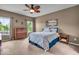 Cozy bedroom with neutral walls, ceiling fan, and natural light at 11438 Montoya Dr, Zionsville, IN 46077