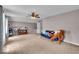 Versatile bonus room featuring neutral paint, ample lighting, and cozy seating at 11438 Montoya Dr, Zionsville, IN 46077