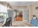 Office space that opens to a dining room with hardwood floors and a chandelier at 11438 Montoya Dr, Zionsville, IN 46077