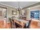 Formal dining room with crown molding and hardwood floors at 11438 Montoya Dr, Zionsville, IN 46077