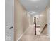 Upstairs hallway with carpet, stairwell, and neutral paint at 11438 Montoya Dr, Zionsville, IN 46077