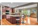Open kitchen with a large island, wooden cabinets, and hardwood floors at 11438 Montoya Dr, Zionsville, IN 46077