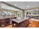 Open-concept kitchen with granite countertops flows into the living room at 11438 Montoya Dr, Zionsville, IN 46077