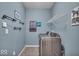 Well-equipped laundry room featuring stainless steel washer and dryer and ample storage at 11438 Montoya Dr, Zionsville, IN 46077