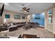 Bright living room with a large sectional sofa, and view into the next room at 11438 Montoya Dr, Zionsville, IN 46077