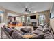 Spacious living room with a fireplace, large sectional sofa and open layout at 11438 Montoya Dr, Zionsville, IN 46077