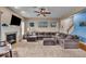 Comfortable living room with fireplace, sectional sofa, and open floor plan at 11438 Montoya Dr, Zionsville, IN 46077