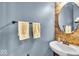 Charming powder room featuring a wooden accent wall and stylish sink at 11438 Montoya Dr, Zionsville, IN 46077