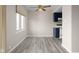 Dining area near the kitchen features a window, neutral paint and wood floors and a ceiling fan at 1151 Canterbury Ct # D, Indianapolis, IN 46260