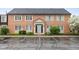 Attractive brick building with accessible parking spots and blue door at 1151 Canterbury Ct # D, Indianapolis, IN 46260