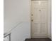 Entryway featuring a white front door with wainscoting on the adjacent walls at 1151 Canterbury Ct # D, Indianapolis, IN 46260
