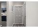 Entryway featuring a gray front door and adjacent closet, offering a welcoming first impression at 1151 Canterbury Ct # D, Indianapolis, IN 46260