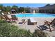 Community pool surrounded by lounge chairs, offering a relaxing outdoor experience at 1151 Canterbury Ct # D, Indianapolis, IN 46260