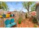 Charming backyard with garden decor, wooden fence and sitting area perfect for relaxing and entertaining at 116 High St, Brooklyn, IN 46111