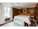 Cozy main bedroom with stylish decor, neutral colors, and natural light at 116 High St, Brooklyn, IN 46111
