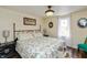Cozy bedroom with wood floors, a large bed, and a window with natural light at 116 High St, Brooklyn, IN 46111