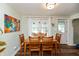 Bright dining room with hardwood floors and modern lighting, creating a welcoming atmosphere for meals at 116 High St, Brooklyn, IN 46111