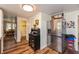 Bright kitchen view showcasing stainless steel refrigerator and dining area at 116 High St, Brooklyn, IN 46111