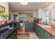 Charming kitchen featuring custom cabinets, butcher block countertops, and updated appliances for modern cooking at 116 High St, Brooklyn, IN 46111