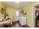 Functional laundry room with washer, dryer, and ample storage space at 116 High St, Brooklyn, IN 46111