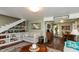 Spacious living room with built-in shelving, providing ample storage and display space, and opens to the dining area at 116 High St, Brooklyn, IN 46111