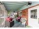 Inviting screened-in porch featuring comfortable seating and a ceiling fan, perfect for relaxing and entertaining at 116 High St, Brooklyn, IN 46111