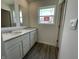 Bathroom featuring double vanity, quartz countertops and hardwood flooring at 1216 Mcbride St, Greenfield, IN 46140