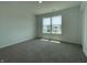 Carpeted bedroom with natural light from window showcasing an unfinished home at 1216 Mcbride St, Greenfield, IN 46140