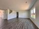 Open living room boasts durable floors, bright light and an open staircase at 1216 Mcbride St, Greenfield, IN 46140