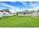Large backyard featuring lush lawn and view of the detached garage at 126 Brunswick Dr, Greenwood, IN 46143
