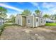 Home's backyard features partial fencing, vinyl siding and a paved area for parking at 126 Brunswick Dr, Greenwood, IN 46143