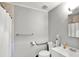 Accessible bathroom with grab bars, walk-in shower and white vanity at 126 Brunswick Dr, Greenwood, IN 46143