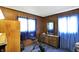 Wood paneled bedroom with stationary bike and bright natural lighting at 126 Brunswick Dr, Greenwood, IN 46143