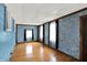 Bright bedroom with wood floors, blue walls and two windows with curtains at 126 Brunswick Dr, Greenwood, IN 46143